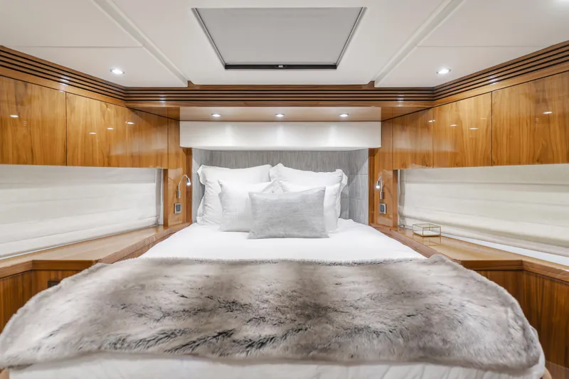 Slide: The Image of Luxurious bedroom interior of 2017 Sunseeker 75 Yacht with elegant wood paneling and plush bedding. - 41