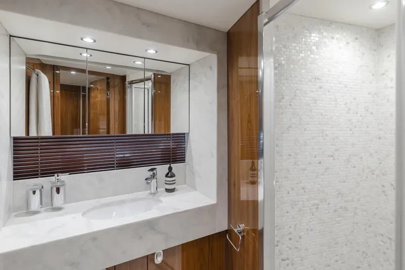 Slide: The Image of Luxurious bathroom in a 2017 Sunseeker 75 Yacht, featuring elegant marble and wood finishes. - 43