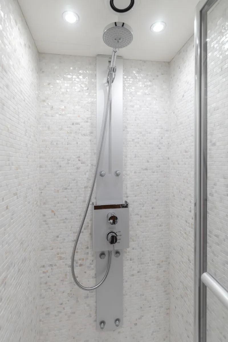 Slide: The Image of Luxurious shower in 2017 Sunseeker 75 Yacht with modern fixtures and elegant white tiling. - 44