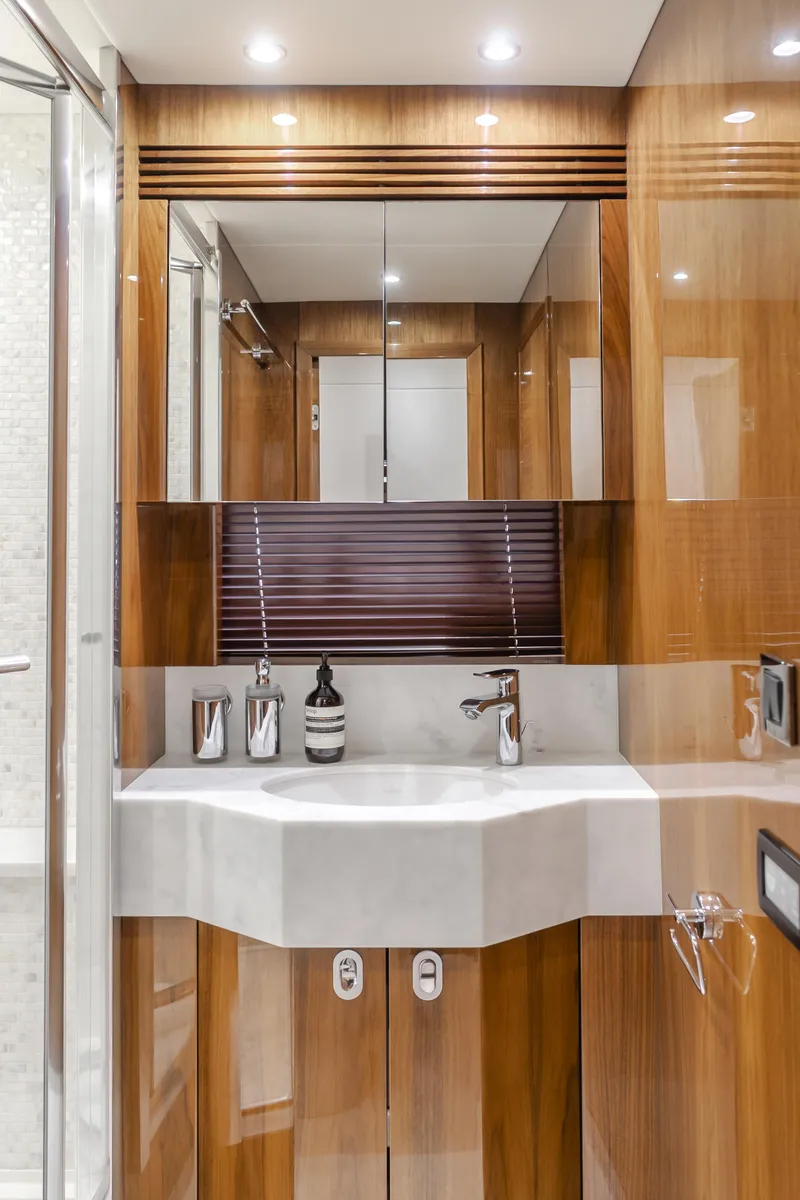 Slide: The Image of Luxurious bathroom interior of 2017 Sunseeker 75 Yacht with modern fixtures and wood paneling. - 47