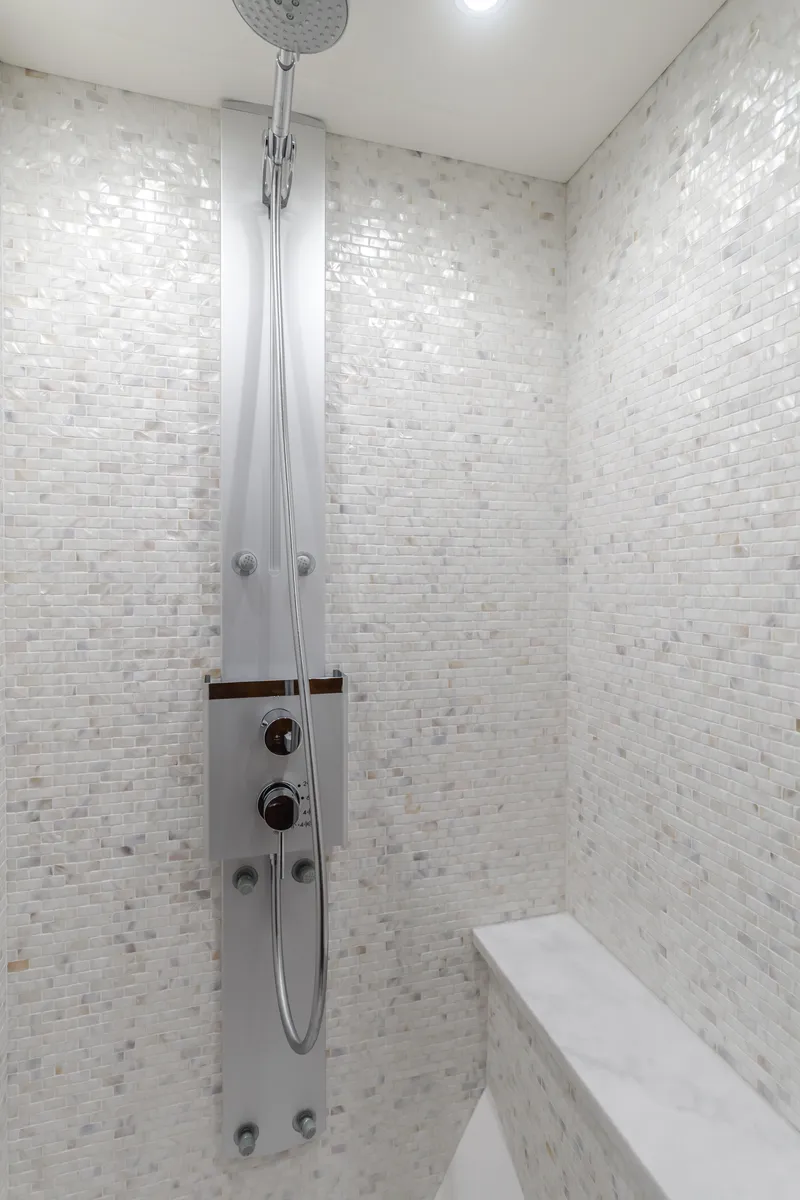 Slide: The Image of Luxurious shower in 2017 Sunseeker 75 Yacht with modern fixtures and white mosaic tiles. - 48