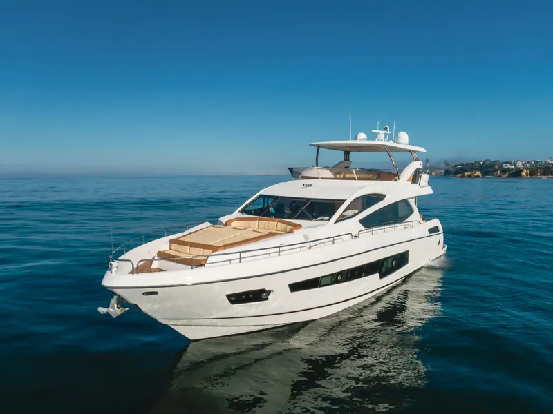 Slide: The Image of Sunseeker 75 Yacht 2017 cruising on calm blue waters under clear sky. - 5