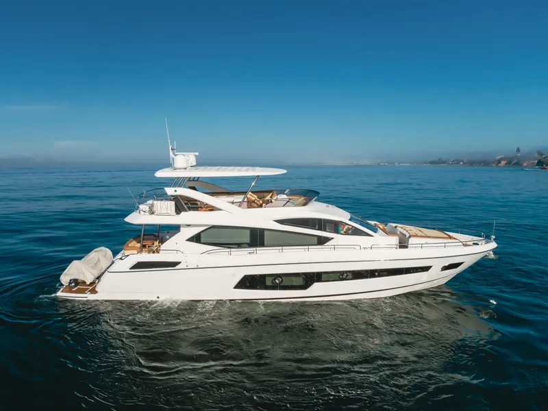 Slide: The Image of 2017 Sunseeker 75 Yacht cruising on calm blue waters under clear skies. - 8