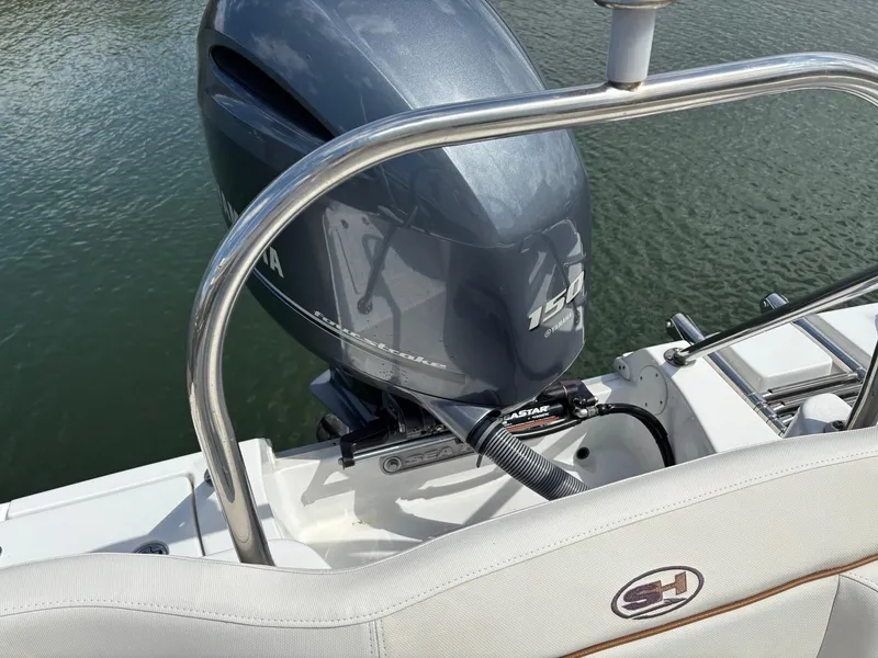 Slide: The Image of 2022 Sea Hunt Ultra 219 boat with Yamaha 150 engine on water. - 16