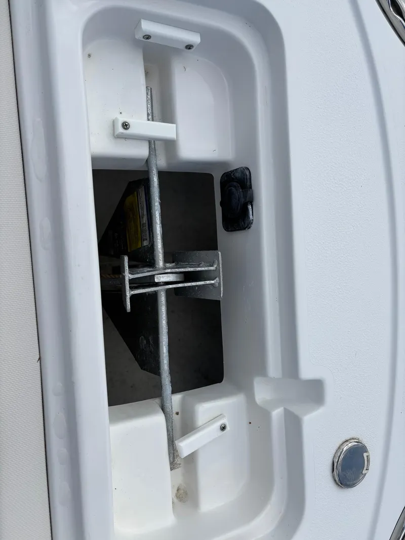 Slide: The Image of Anchor storage compartment on a 2022 Sea Hunt Ultra 219 boat. - 18