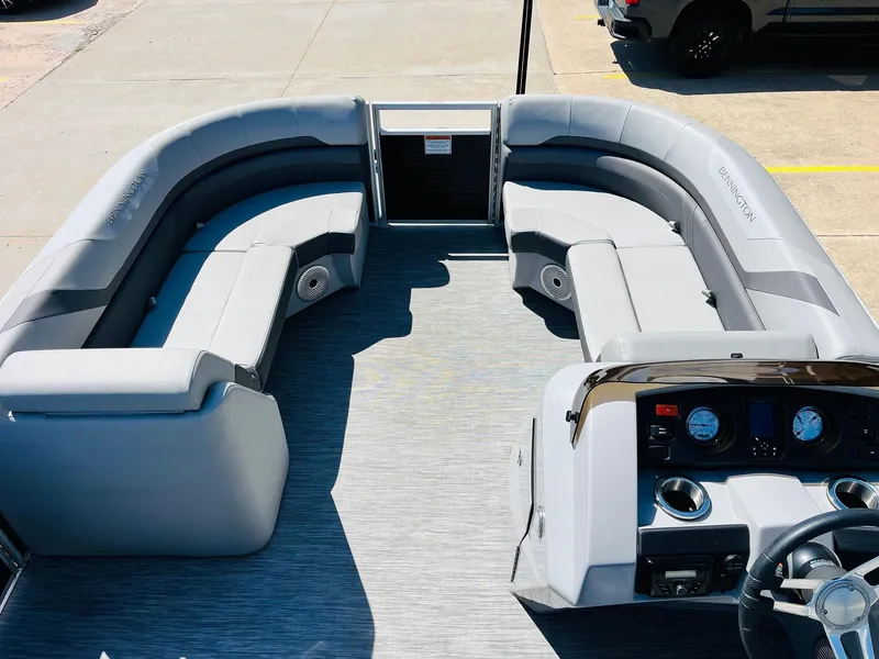 Slide: The Image of 2021 Bennington SX 22 Stern Lounge interior with gray seating and control panel. - 12