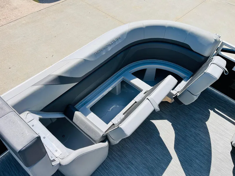 Slide: The Image of 2021 Bennington SX 22 Stern Lounge with gray seating and storage compartment. - 17