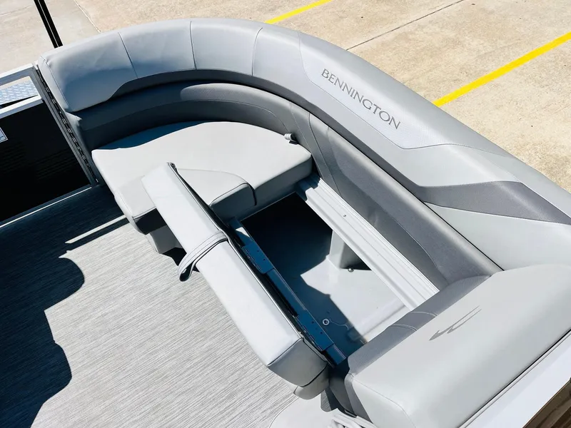 Slide: The Image of 2021 Bennington SX 22 Stern Lounge with gray seating and storage compartment. - 19