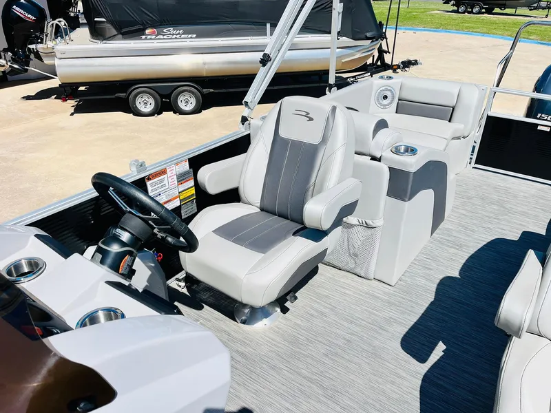 Slide: The Image of 2021 Bennington SX 22 Stern Lounge interior with plush seating and modern helm. - 24
