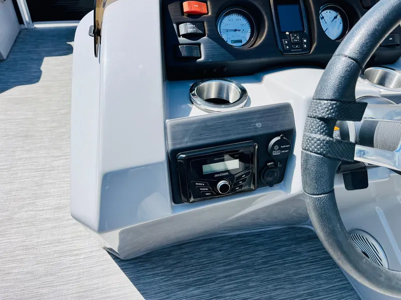 Slide: The Image of Control panel of 2021 Bennington SX 22 Stern Lounge boat with steering wheel and gauges. - 26