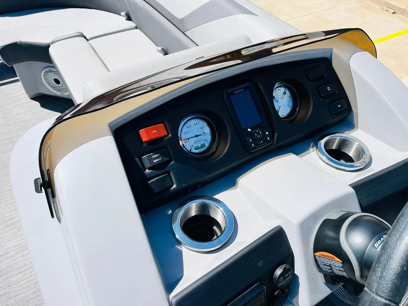 Slide: The Image of Dashboard of 2021 Bennington SX 22 Stern Lounge boat with gauges and controls. - 27