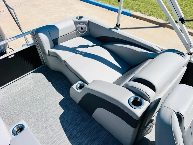 Slide: The Image of 2021 Bennington SX 22 Stern Lounge with gray seating and cup holders. - 28