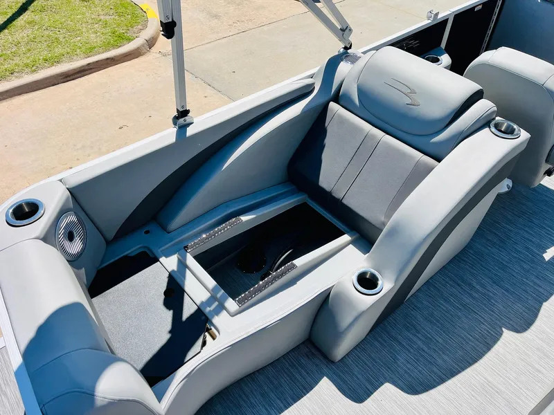 Slide: The Image of 2021 Bennington SX 22 Stern Lounge with gray seating and cup holders. - 29