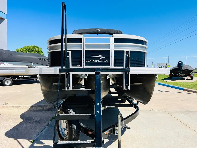 Slide: The Image of 2021 Bennington SX 22 Stern Lounge pontoon boat on trailer, front view. - 3