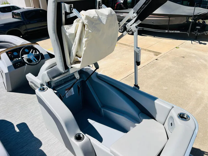 Slide: The Image of 2021 Bennington SX 22 Stern Lounge boat interior with open storage compartment. - 33