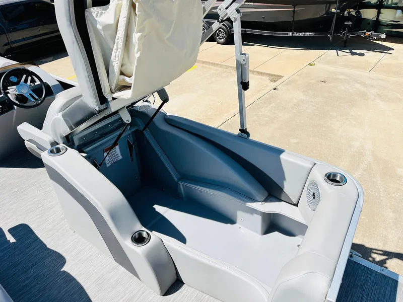 Slide: The Image of 2021 Bennington SX 22 Stern Lounge interior with gray seating and cup holders. - 34