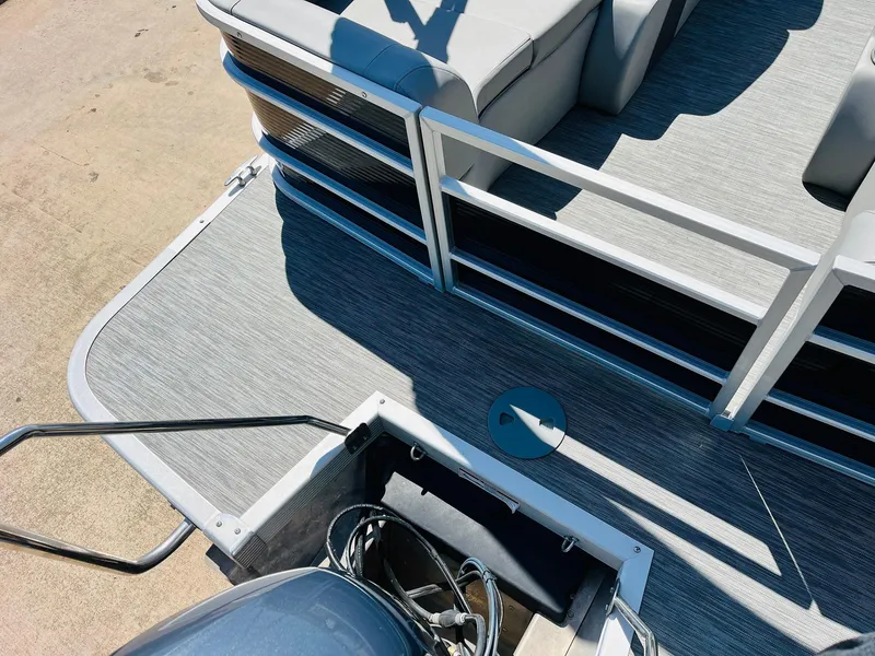 Slide: The Image of 2021 Bennington SX 22 Stern Lounge boat deck with seating and railing, viewed from above. - 35