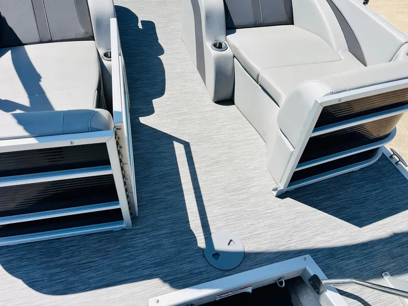 Slide: The Image of 2021 Bennington SX 22 Stern Lounge interior with gray seating and flooring. - 37