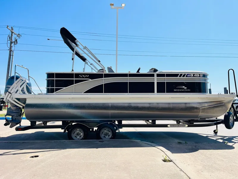 Slide: The Image of 2021 Bennington SX 22 Stern Lounge pontoon boat on trailer, side view. - 5