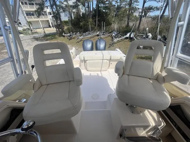 Slide: The Image of 2007 Grady-White 282 Sailfish boat interior with dual seats and twin engines. - 11
