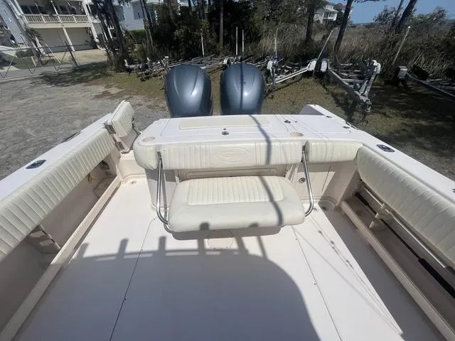 Slide: The Image of 2007 Grady-White 282 Sailfish boat interior with seating and dual engines. - 15