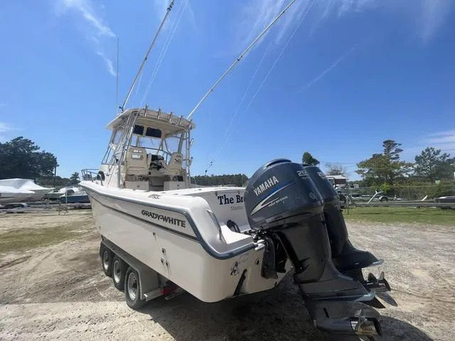 Slide: The Image of 2007 Grady-White 282 Sailfish boat with Yamaha engines on a trailer, parked outdoors. - 4