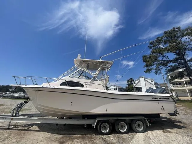 Slide: The Image of 2007 Grady-White 282 Sailfish boat on trailer under clear blue sky. - 3
