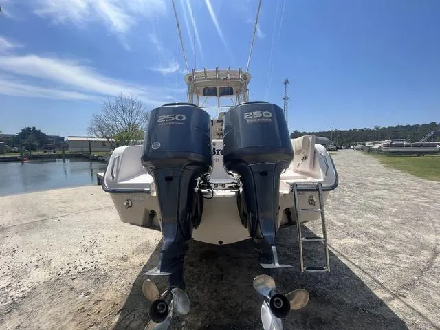 Slide: The Image of 2007 Grady-White 282 Sailfish boat with twin 250 horsepower engines, docked outdoors. - 5