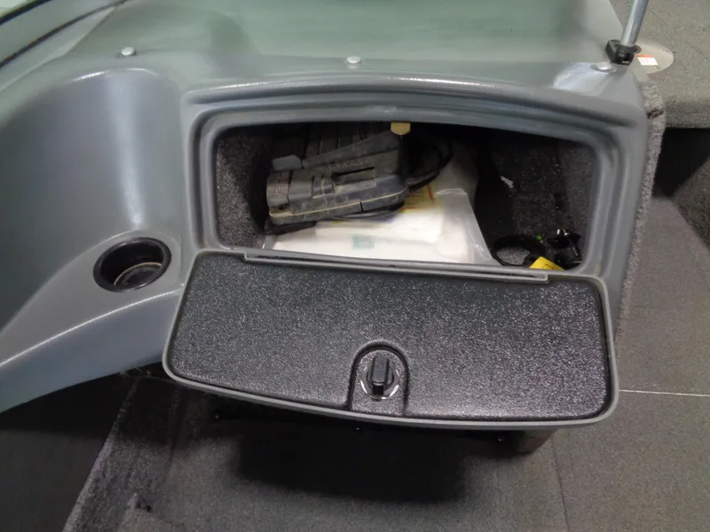 Slide: The Image of 2003 Lund 1800 Fisherman OB storage compartment with equipment inside. - 18