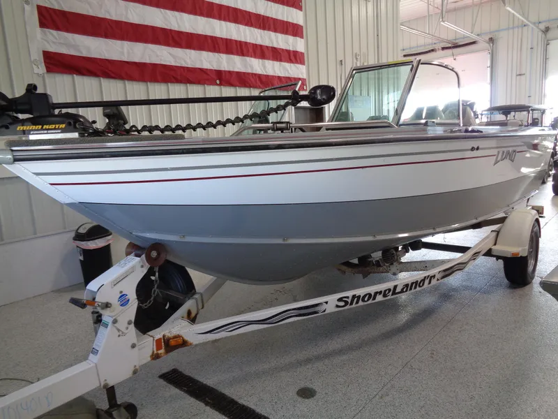 Slide: The Image of 2003 Lund 1800 Fisherman OB boat on ShoreLand'r trailer in a garage. - 7