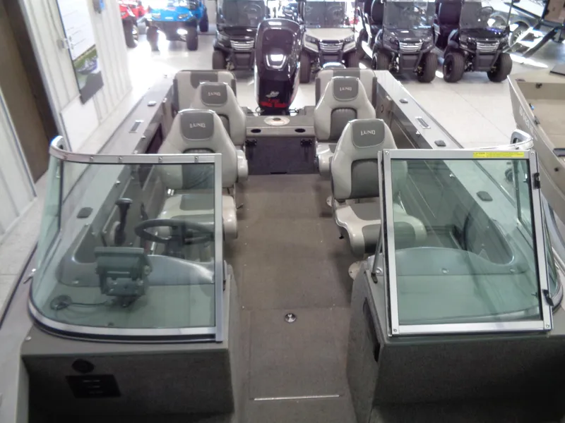 Slide: The Image of 2003 Lund 1800 Fisherman OB boat interior with seating and windshield. - 8