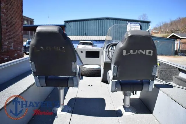 Slide: The Image of 2015 Lund 1800 Alaskan boat interior with two seats and steering console. - 11