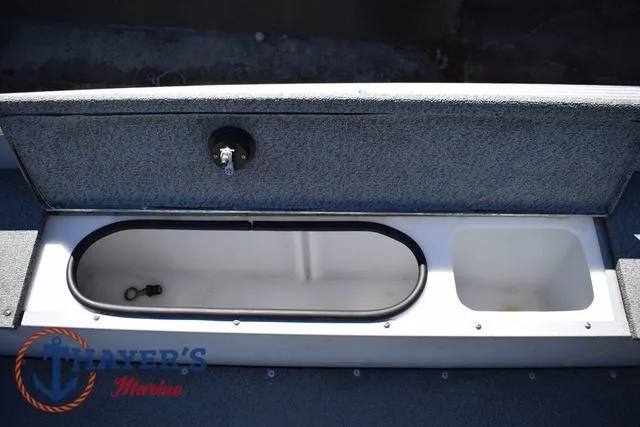 Slide: The Image of Open storage compartment in a 2015 Lund 1800 Alaskan boat. - 20