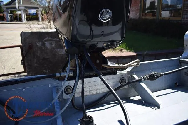 Slide: The Image of 2015 Lund 1800 Alaskan boat with Mercury outboard motor, showing engine connections. - 26