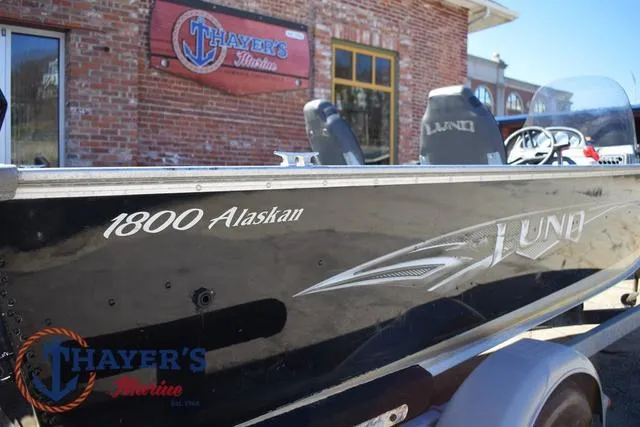 Slide: The Image of 2015 Lund 1800 Alaskan boat displayed outside Thayer's Marine store. - 32