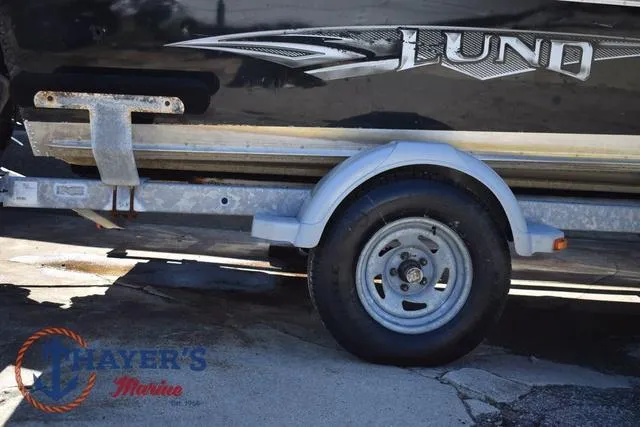 Slide: The Image of Trailer with 2015 Lund 1800 Alaskan boat, featuring Thayer's Marine logo. - 33