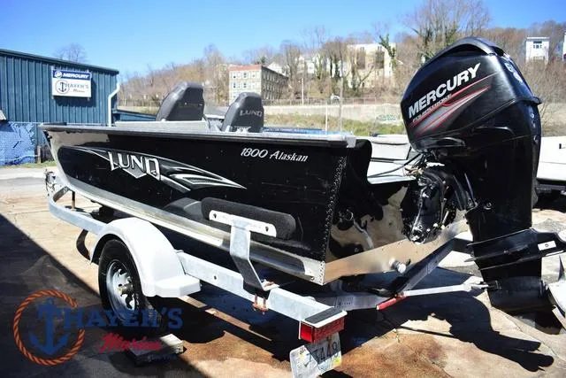 Slide: The Image of 2015 Lund 1800 Alaskan boat with Mercury engine on trailer, outdoor setting. - 5