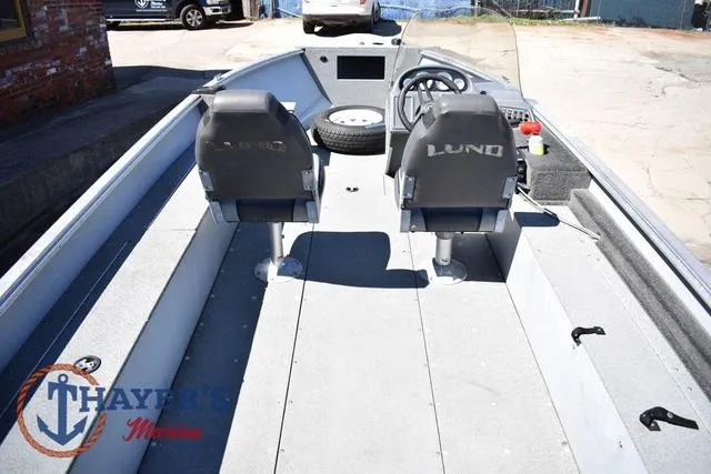 Slide: The Image of 2015 Lund 1800 Alaskan boat interior with two seats and steering console. - 8
