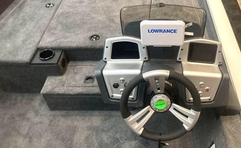 Slide: The Image of 2025 Tracker Pro Team™ 190 boat dashboard with Lowrance electronics and steering wheel. - 5