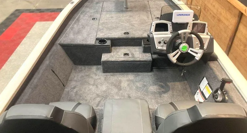 Slide: The Image of 2025 Tracker Pro Team™ 190 boat interior with steering wheel and seating. - 6
