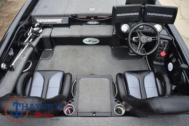 Slide: The Image of 2019 Phoenix Bass Boats 920 interior with dual seats, steering wheel, and Humminbird electronics. - 12