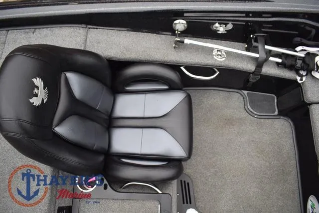 Slide: The Image of 2019 Phoenix Bass Boats 920 interior with black leather seat and fishing rod holder. - 16