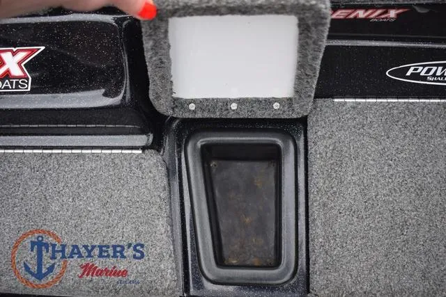 Slide: The Image of 2019 Phoenix Bass Boats 920 storage compartment with Thayer's Marine logo. - 21