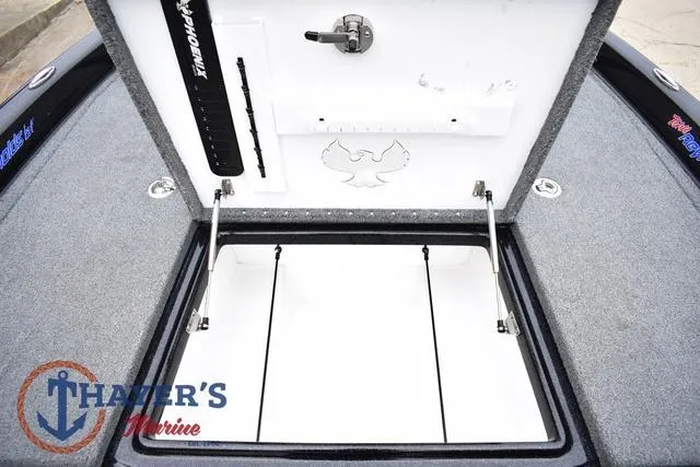 Slide: The Image of 2019 Phoenix Bass Boats 920 storage compartment with open lid, showcasing interior design and branding. - 26