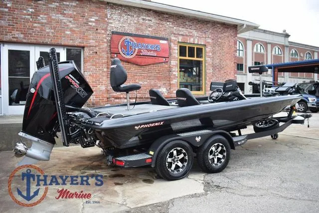 Slide: The Image of 2019 Phoenix Bass Boats 920 at Thayer's Marine dealership, featuring sleek design and powerful engine. - 3