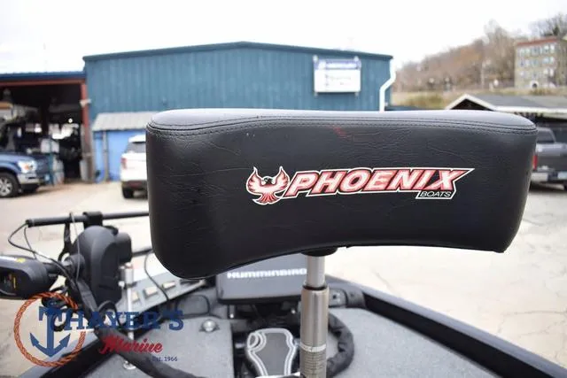 Slide: The Image of 2019 Phoenix Bass Boats 920 seat with logo, in a marina setting. - 30