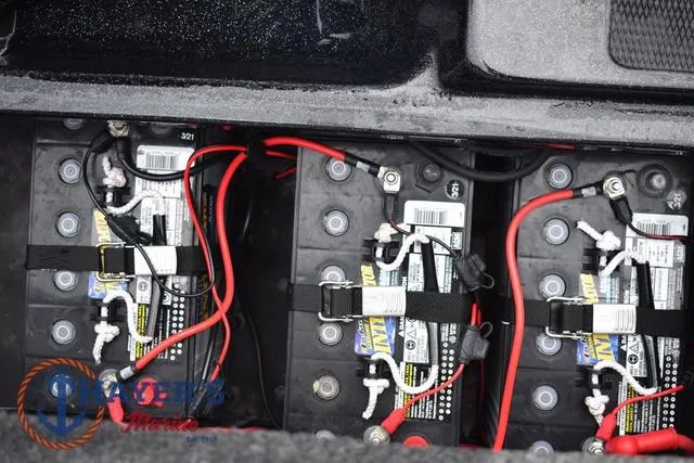 Slide: The Image of Batteries in a 2019 Phoenix Bass Boats 920, secured with red and black cables. - 40