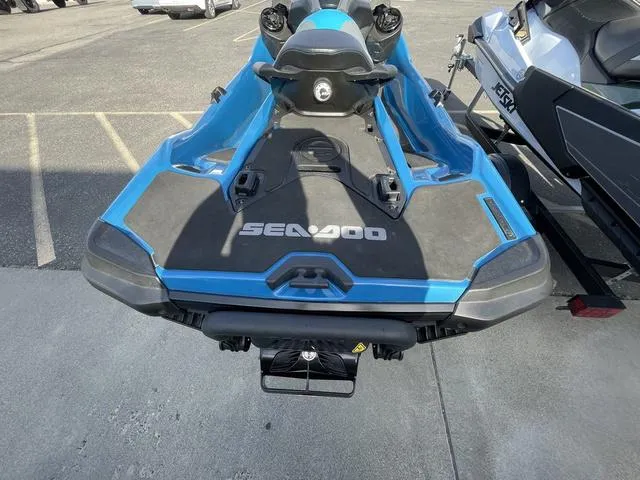 Slide: The Image of 2018 Sea-Doo Waverunner GTX in blue, parked on pavement, rear view. - 10