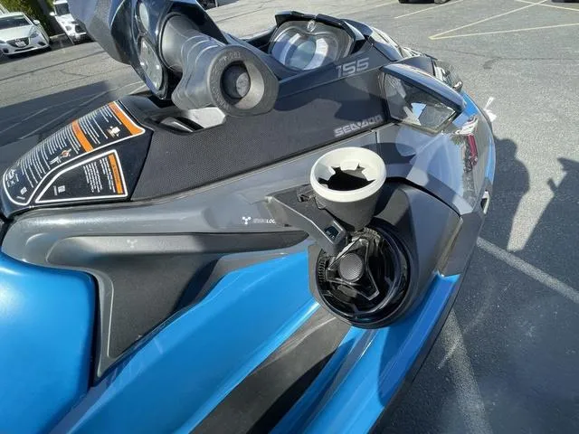 Slide: The Image of 2018 Sea-Doo Waverunner GTX, blue and black, parked in a lot, close-up view. - 11
