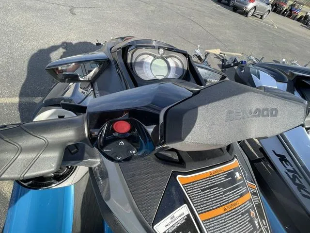 Slide: The Image of 2018 Sea-Doo Waverunner GTX dashboard and controls in a parking lot. - 8